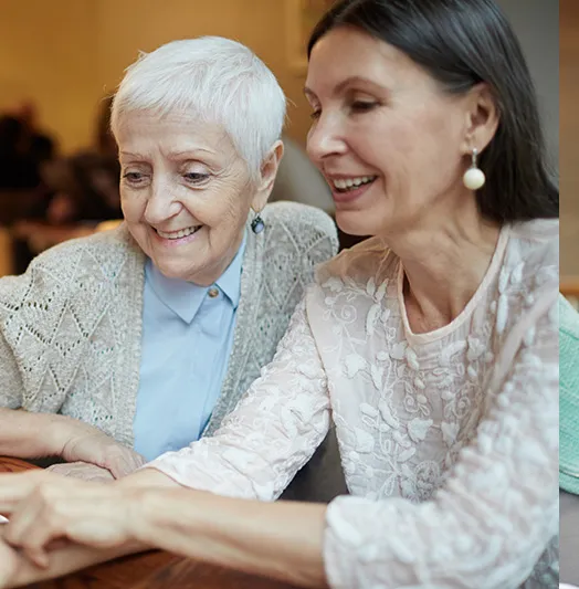 Caregiver spending time with an elderly resident